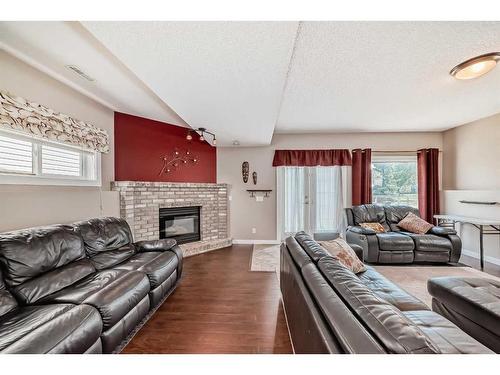 962 Harvest Hills Drive Ne, Calgary, AB - Indoor Photo Showing Living Room With Fireplace