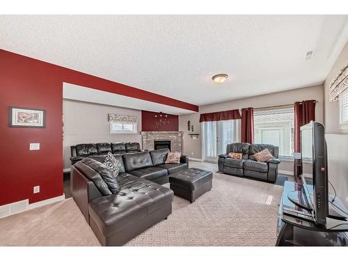 962 Harvest Hills Drive Ne, Calgary, AB - Indoor Photo Showing Living Room With Fireplace