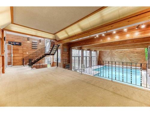 163 Malibou Road Sw, Calgary, AB - Indoor Photo Showing Other Room With In Ground Pool