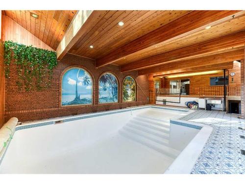 163 Malibou Road Sw, Calgary, AB - Indoor Photo Showing Other Room With In Ground Pool