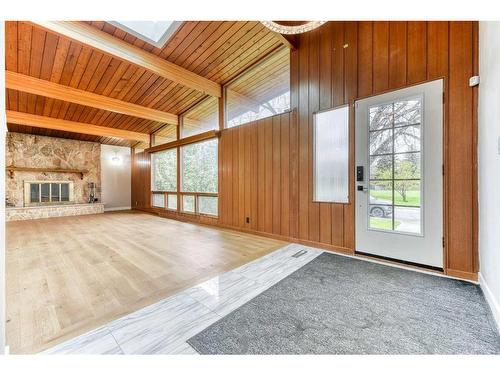 163 Malibou Road Sw, Calgary, AB - Indoor Photo Showing Other Room With Fireplace