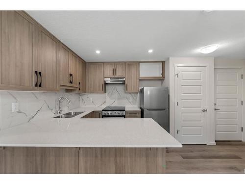 91 Cityline Heath Ne, Calgary, AB - Indoor Photo Showing Kitchen With Stainless Steel Kitchen With Double Sink