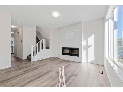 91 Cityline Heath Ne, Calgary, AB - Indoor Photo Showing Living Room With Fireplace