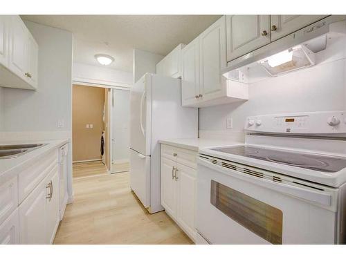 117-33 Arbour Grove Close Nw, Calgary, AB - Indoor Photo Showing Kitchen With Double Sink