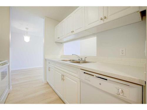 117-33 Arbour Grove Close Nw, Calgary, AB - Indoor Photo Showing Kitchen With Double Sink