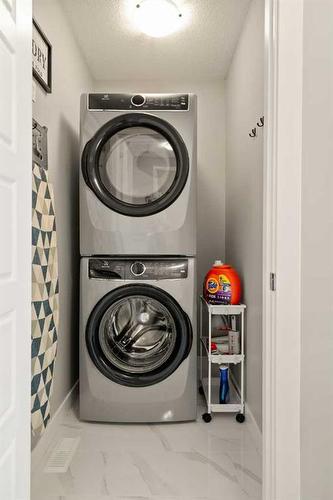 133 Ambleside Heath Nw, Calgary, AB - Indoor Photo Showing Laundry Room