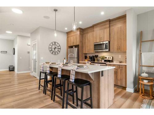 133 Ambleside Heath Nw, Calgary, AB - Indoor Photo Showing Kitchen With Upgraded Kitchen