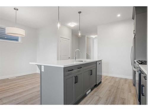 18 Amblefield Passage Nw, Calgary, AB - Indoor Photo Showing Kitchen With Upgraded Kitchen