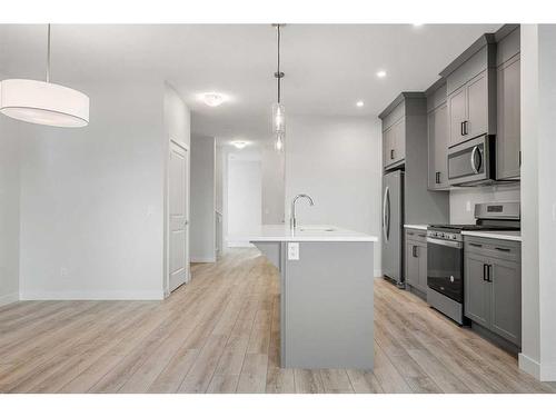 18 Amblefield Passage Nw, Calgary, AB - Indoor Photo Showing Kitchen With Upgraded Kitchen