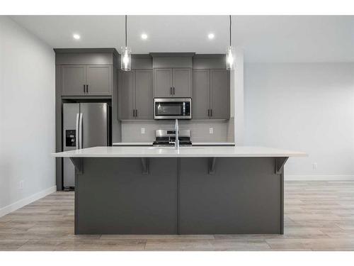 18 Amblefield Passage Nw, Calgary, AB - Indoor Photo Showing Kitchen With Upgraded Kitchen