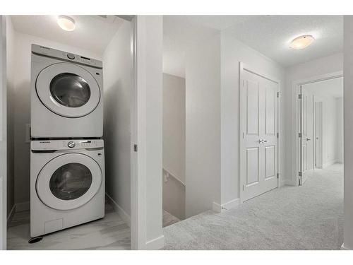 18 Amblefield Passage Nw, Calgary, AB - Indoor Photo Showing Laundry Room