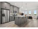 18 Amblefield Passage Nw, Calgary, AB  - Indoor Photo Showing Kitchen With Stainless Steel Kitchen With Upgraded Kitchen 