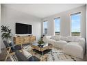 18 Amblefield Passage Nw, Calgary, AB  - Indoor Photo Showing Living Room 