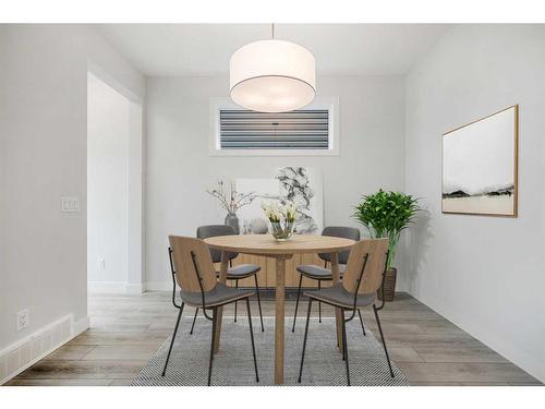 18 Amblefield Passage Nw, Calgary, AB - Indoor Photo Showing Dining Room