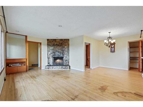 5728 Layzell Road Sw, Calgary, AB - Indoor Photo Showing Living Room With Fireplace