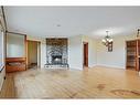 5728 Layzell Road Sw, Calgary, AB  - Indoor Photo Showing Living Room With Fireplace 