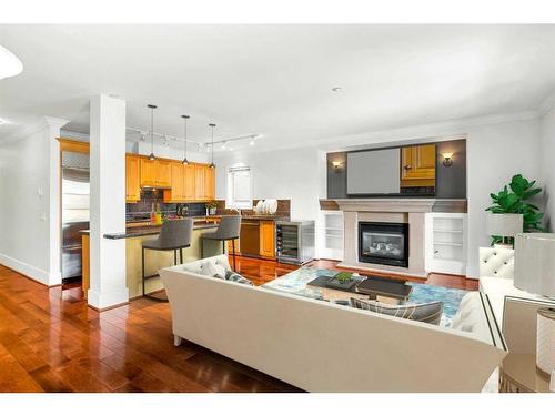 204-1235 Cameron Avenue Sw, Calgary, AB - Indoor Photo Showing Living Room With Fireplace