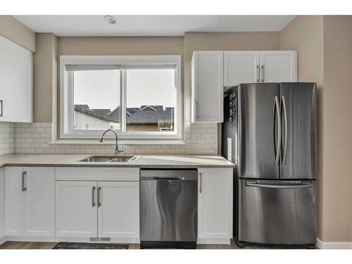 9 Masters Street Se, Calgary, AB - Indoor Photo Showing Kitchen With Stainless Steel Kitchen With Double Sink