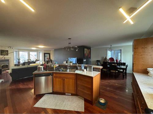 427 23 Avenue Nw, Calgary, AB - Indoor Photo Showing Kitchen With Fireplace With Double Sink