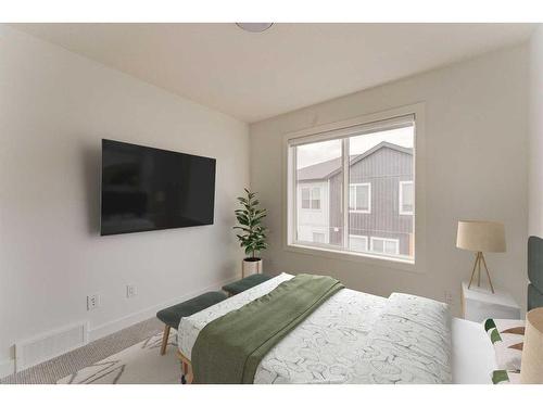 402-280 Chelsea Road, Chestermere, AB - Indoor Photo Showing Bedroom