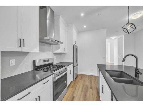 283 Hotchkiss Manor, Calgary, AB - Indoor Photo Showing Kitchen With Double Sink With Upgraded Kitchen