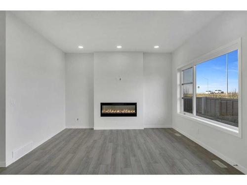 367 Savanna Way Ne, Calgary, AB - Indoor Photo Showing Living Room With Fireplace