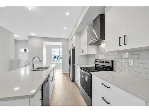 188 Hotchkiss Drive Se, Calgary, AB - Indoor Photo Showing Kitchen With Double Sink With Upgraded Kitchen