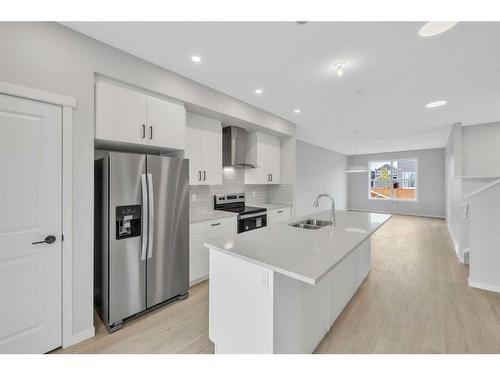 188 Hotchkiss Drive Se, Calgary, AB - Indoor Photo Showing Kitchen With Double Sink With Upgraded Kitchen