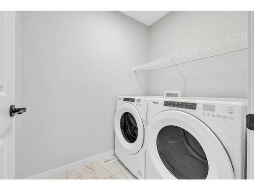 188 Hotchkiss Drive Se, Calgary, AB - Indoor Photo Showing Laundry Room