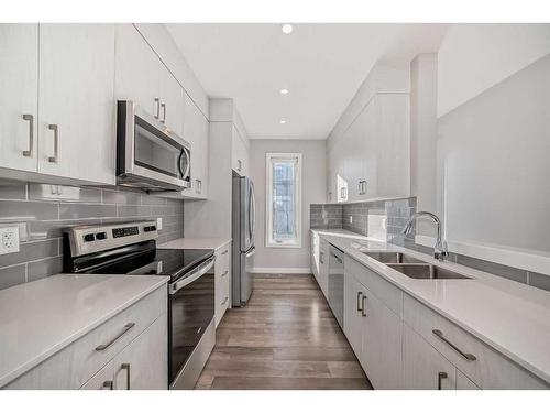 207 Evanscrest Square Nw, Calgary, AB - Indoor Photo Showing Kitchen With Stainless Steel Kitchen With Double Sink With Upgraded Kitchen