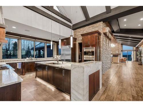 178068 112 Street, De Winton, AB - Indoor Photo Showing Kitchen With Fireplace With Upgraded Kitchen