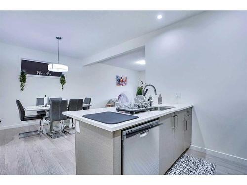 23 Saddlelake Common Ne, Calgary, AB - Indoor Photo Showing Kitchen With Double Sink