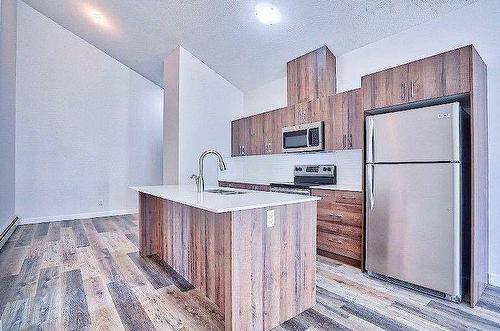 33-303 Waddy Lane, Strathmore, AB - Indoor Photo Showing Kitchen With Stainless Steel Kitchen