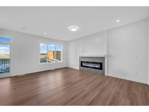 51 Heritage Circle, Cochrane, AB - Indoor Photo Showing Living Room With Fireplace