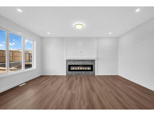 51 Heritage Circle, Cochrane, AB - Indoor Photo Showing Living Room With Fireplace