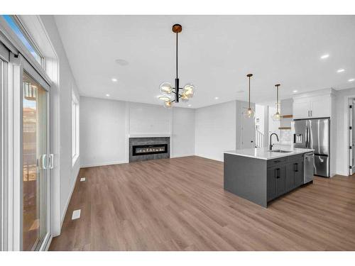 51 Heritage Circle, Cochrane, AB - Indoor Photo Showing Other Room With Fireplace