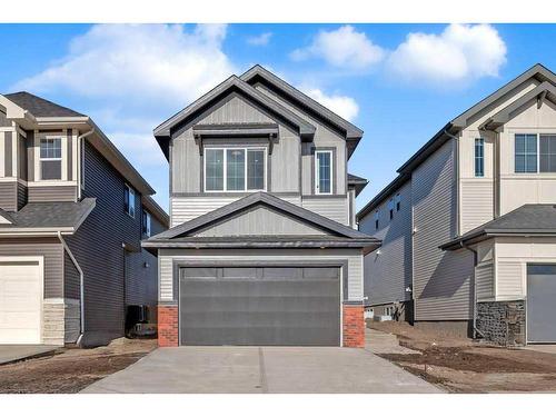 51 Heritage Circle, Cochrane, AB - Outdoor With Facade