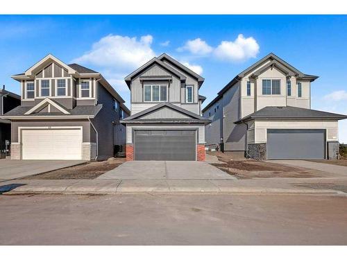 51 Heritage Circle, Cochrane, AB - Outdoor With Facade