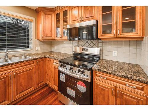 109 Everglade Circle Sw, Calgary, AB - Indoor Photo Showing Kitchen With Double Sink