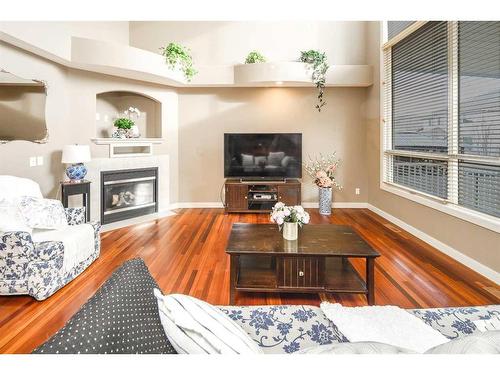 109 Everglade Circle Sw, Calgary, AB - Indoor Photo Showing Living Room With Fireplace