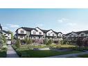 418-1750 Rangeview Drive Se, Okotoks, AB  - Outdoor With Facade 