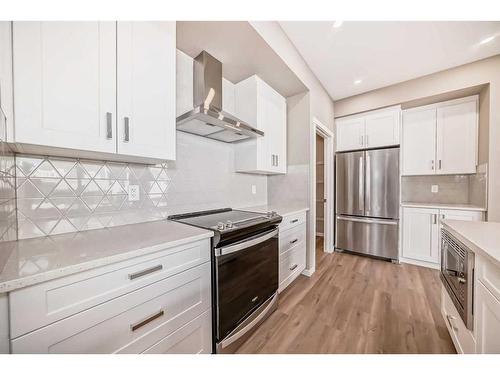 180 Magnolia Terrace Se, Calgary, AB - Indoor Photo Showing Kitchen With Upgraded Kitchen