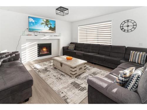 125 South Shore View, Chestermere, AB - Indoor Photo Showing Living Room With Fireplace