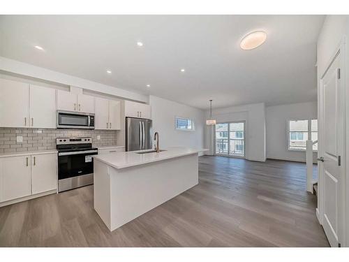 1038 Thimbleberry Hill Sw, Airdrie, AB - Indoor Photo Showing Kitchen With Upgraded Kitchen