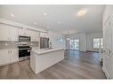 1038 Thimbleberry Hill Sw, Airdrie, AB  - Indoor Photo Showing Kitchen With Upgraded Kitchen 