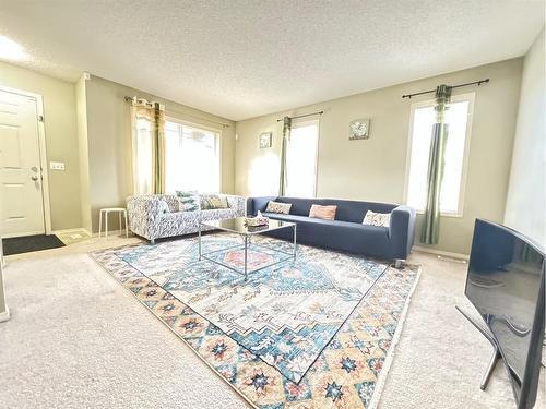 30 Panatella Street Nw, Calgary, AB - Indoor Photo Showing Living Room