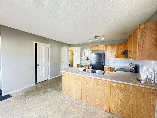 30 Panatella Street Nw, Calgary, AB - Indoor Photo Showing Kitchen With Double Sink