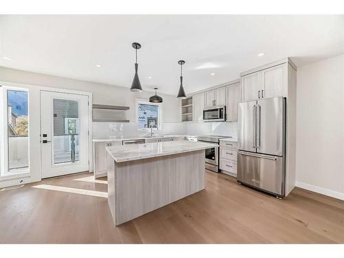 115-1330 1St Ave, Canmore, AB - Indoor Photo Showing Kitchen With Upgraded Kitchen