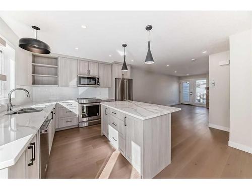 115-1330 1St Ave, Canmore, AB - Indoor Photo Showing Kitchen With Double Sink With Upgraded Kitchen