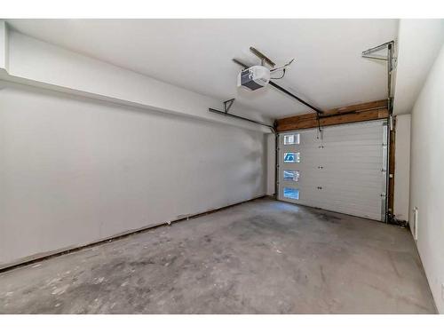 115-1330 1St Ave, Canmore, AB - Indoor Photo Showing Garage